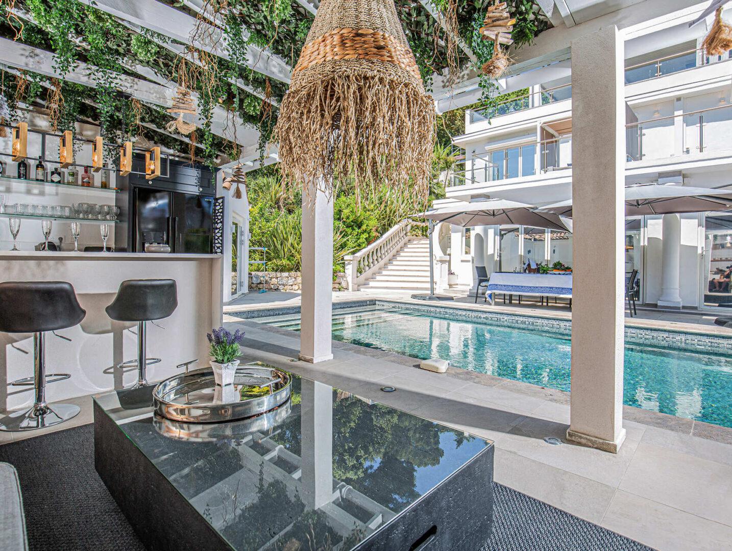 Outdoor lounge area and heated pool at Villa Cap Élan, Cap d'Antibes, Côte d'Azur