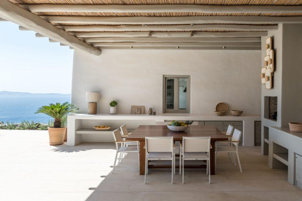 open-plan living room with natural stone interiors at Villa Nema, Mykonos