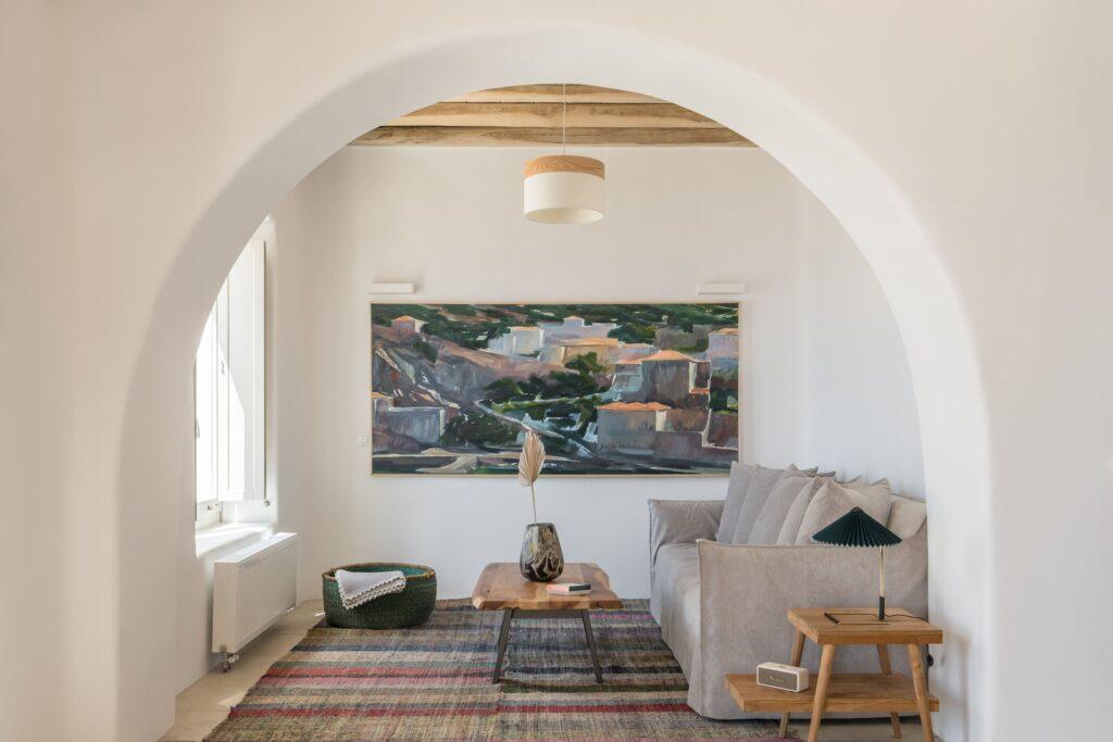 open-plan living room with natural stone interiors at Villa Nema, Mykonos