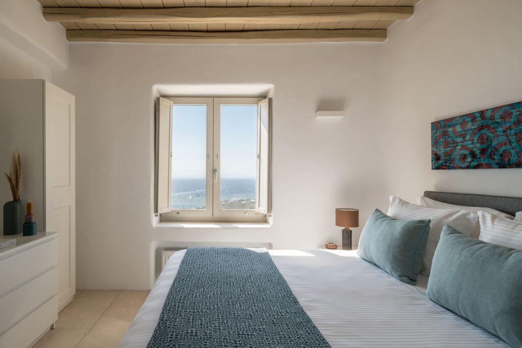 master bedroom with private terrace and Aegean views at Villa Nema, Mykonos