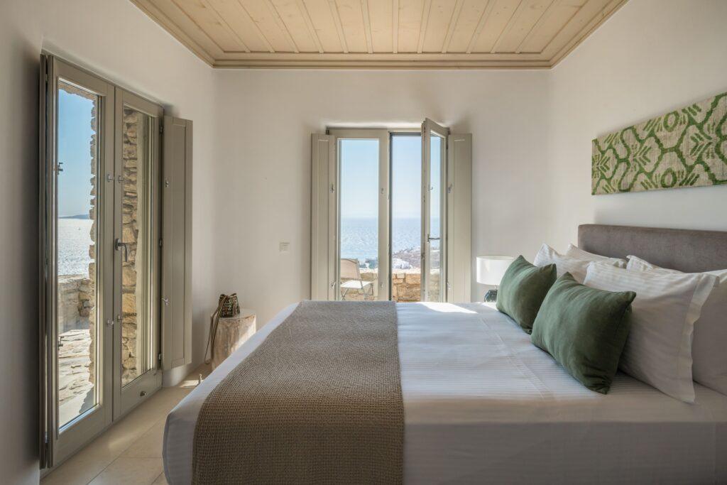 master bedroom with private terrace and Aegean views at Villa Nema, Mykonos