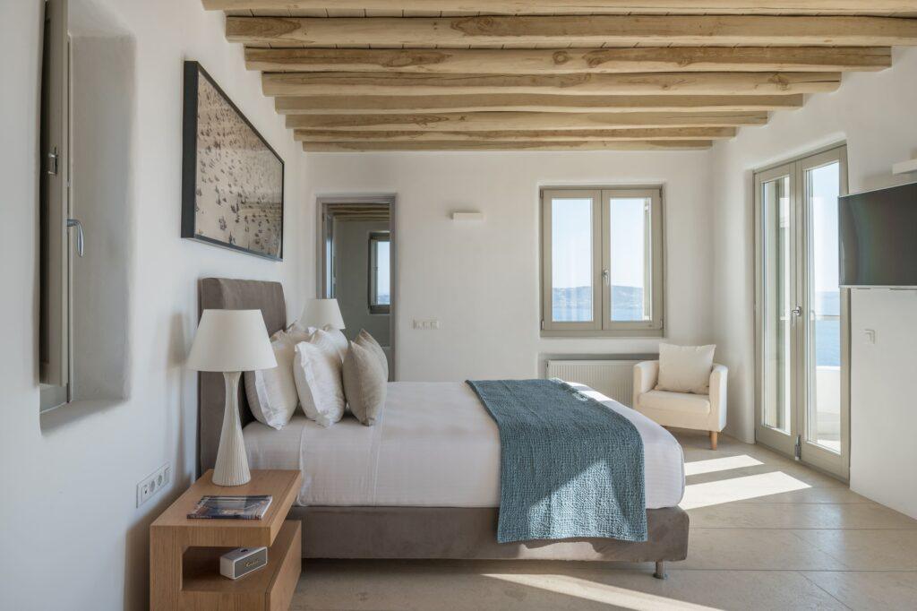 master bedroom with private terrace and Aegean views at Villa Nema, Mykonos