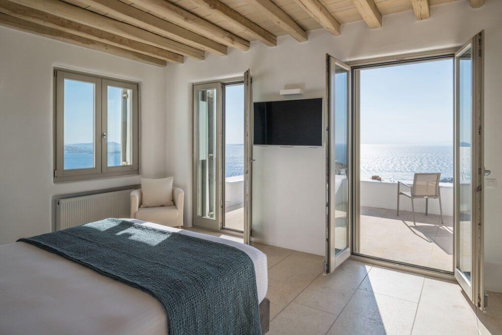 master bedroom with private terrace and Aegean views at Villa Nema, Mykonos