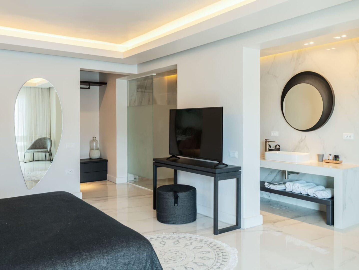 luxury en-suite bedroom with sea view at Vos Estate, 11-bedroom villa Mykonos