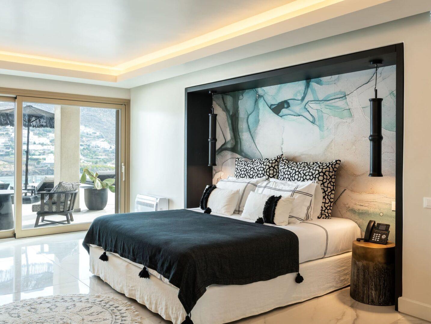 luxury en-suite bedroom with sea view at Vos Estate, 11-bedroom villa Mykonos