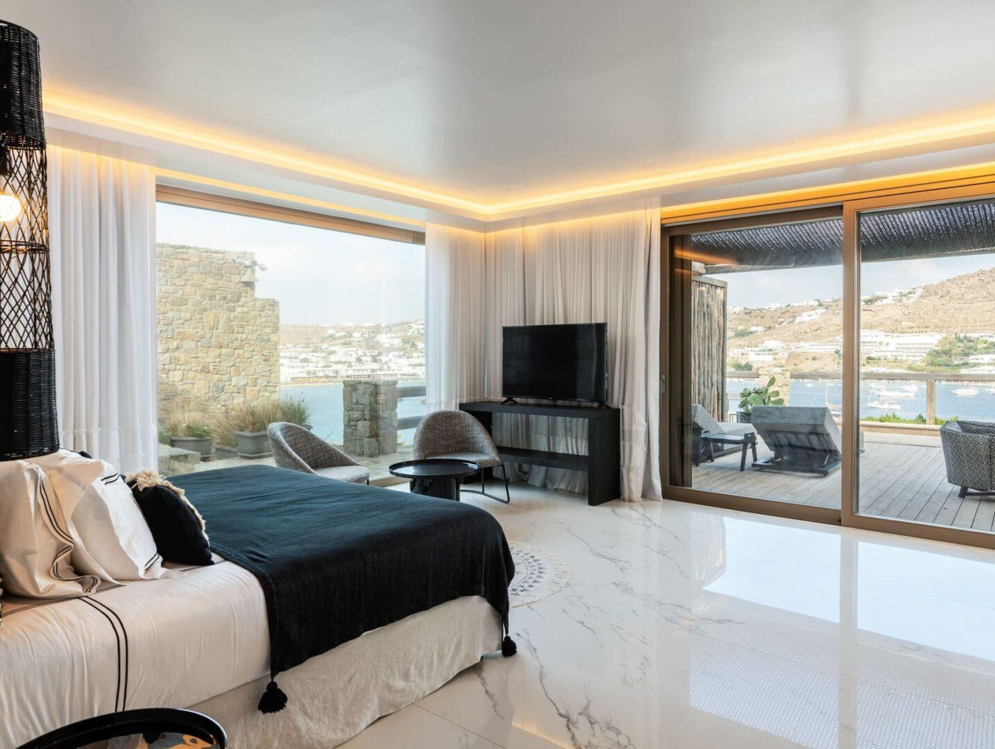 luxury en-suite bedroom with sea view at Vos Estate, 11-bedroom villa Mykonos